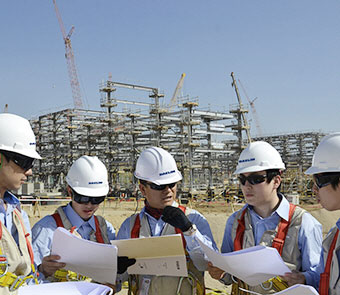 DL E&C Industrial Co., employees who are talking pictures on construction site